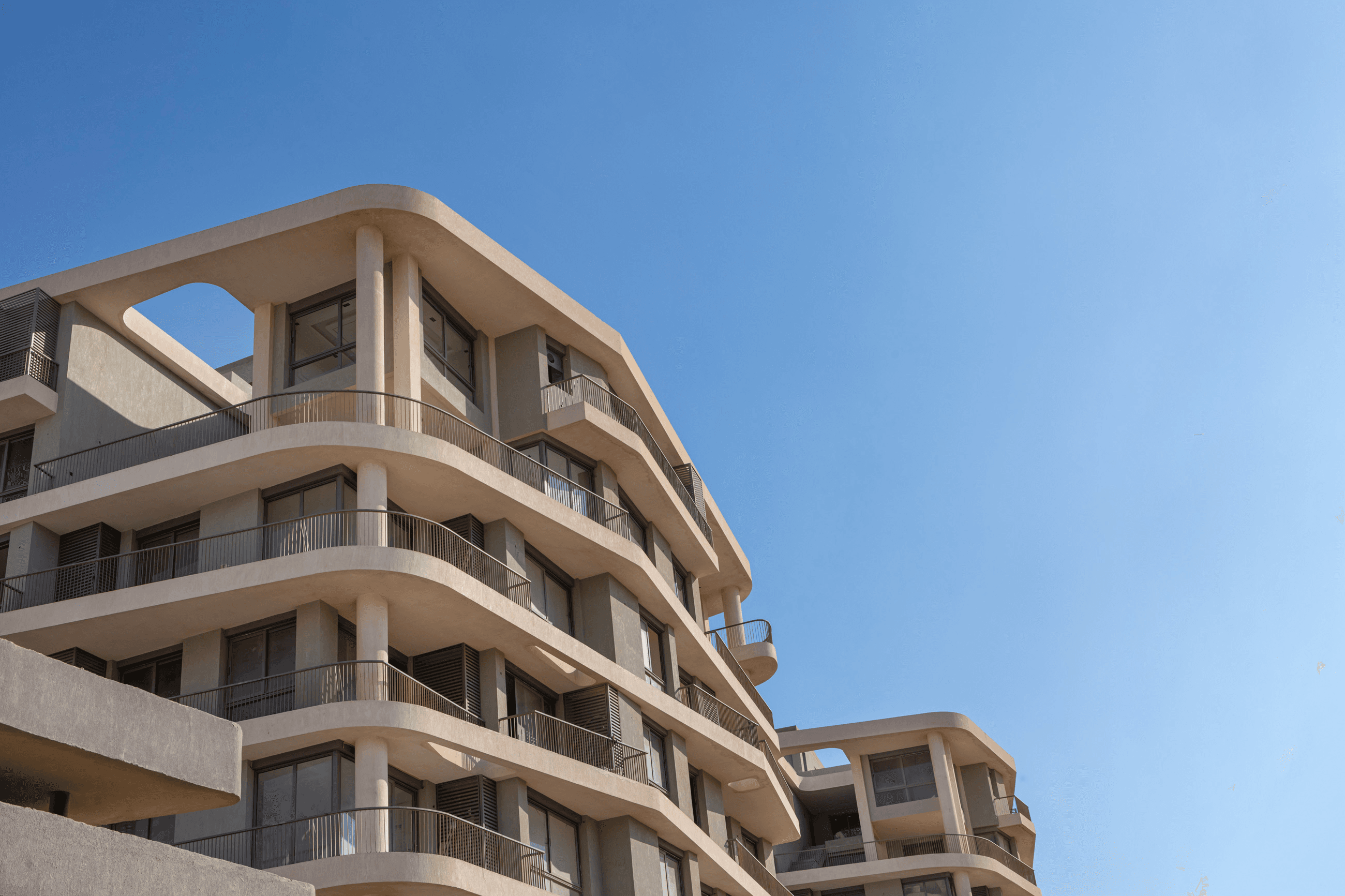 Armonia residential buildings with landscaped grounds in the New Capital R7 District
