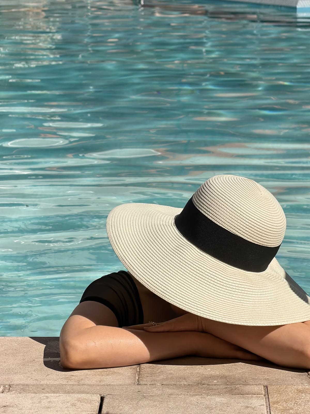 IL Bayou swimming pools with sun loungers and palm trees