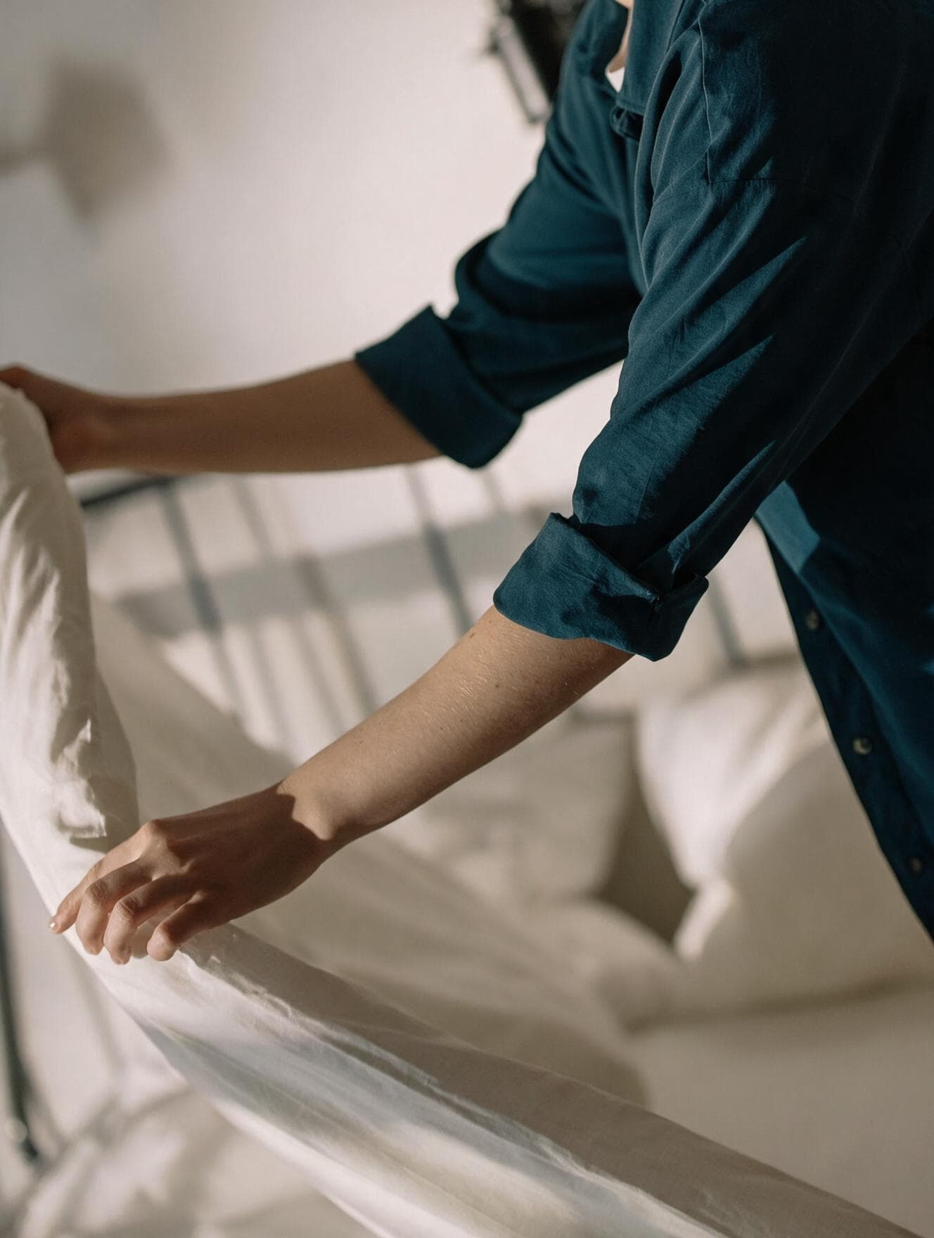 Housekeeper preparing a guest room